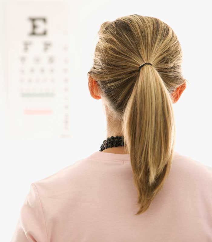 Woman Looking at Eye Chart